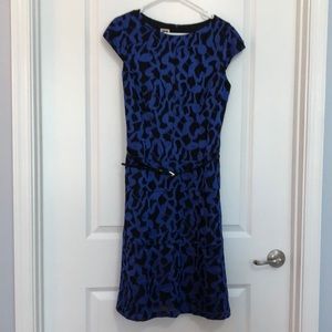 Knee length dress with belt. Tapered at waist and flared at bottom. Worn once.